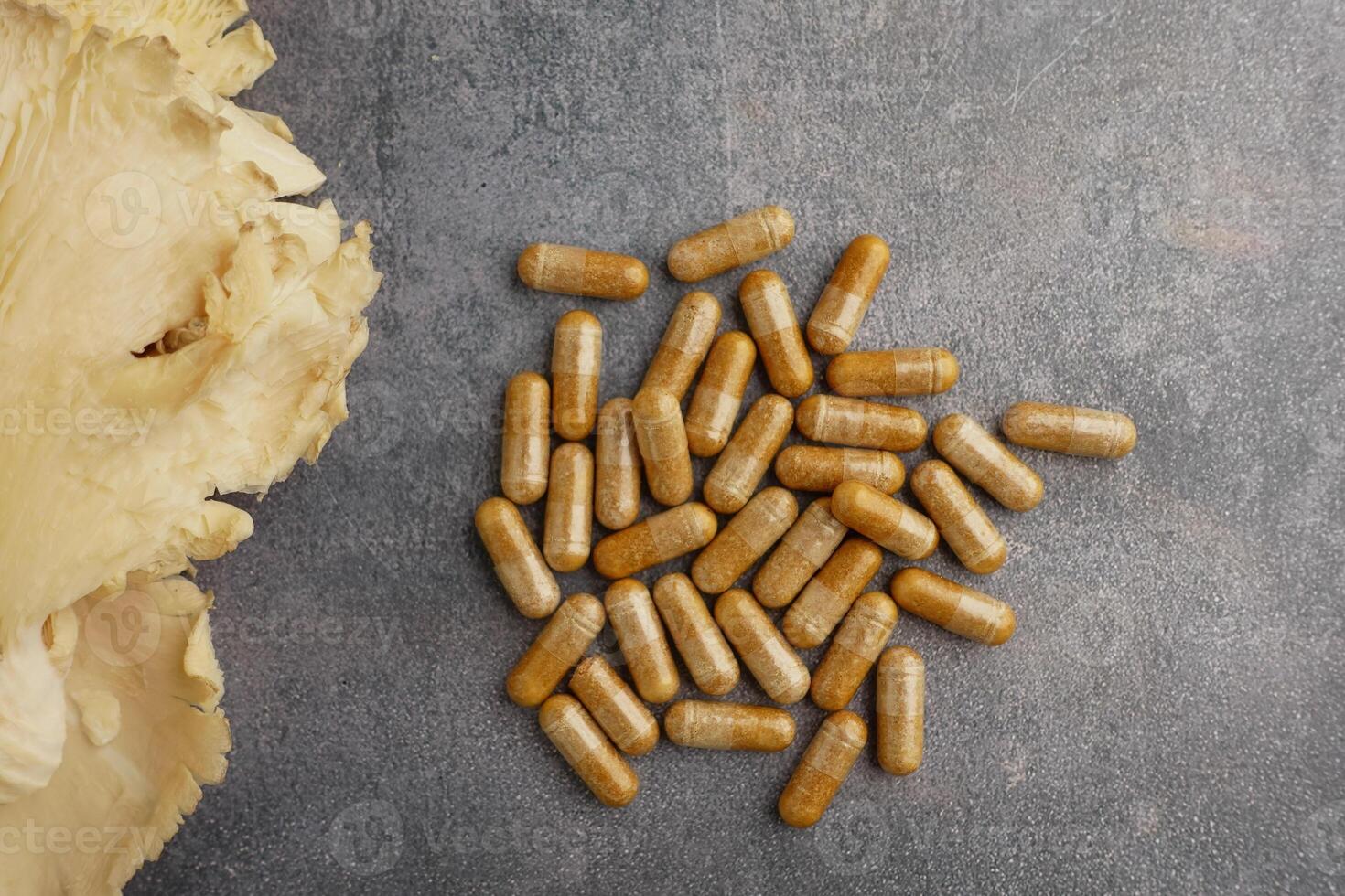 Natural health supplements with mushroom extract on table photo
