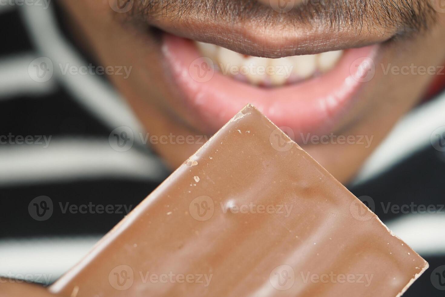 Enjoying chocolate treat with a big smile photo