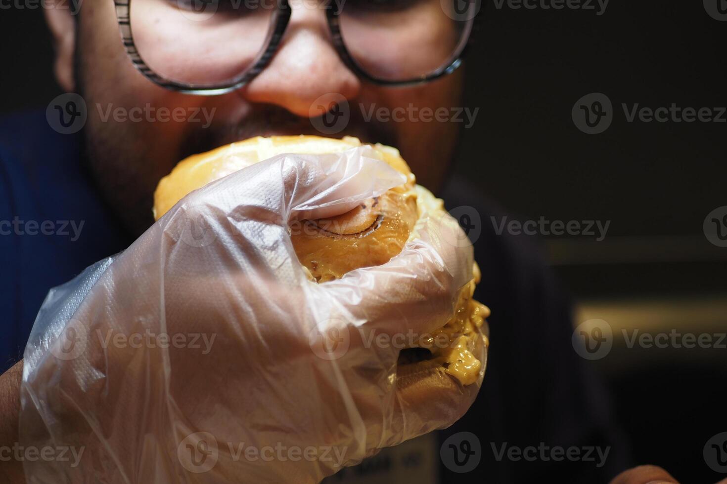Enjoying a burger at a lively diner on a weekend night photo
