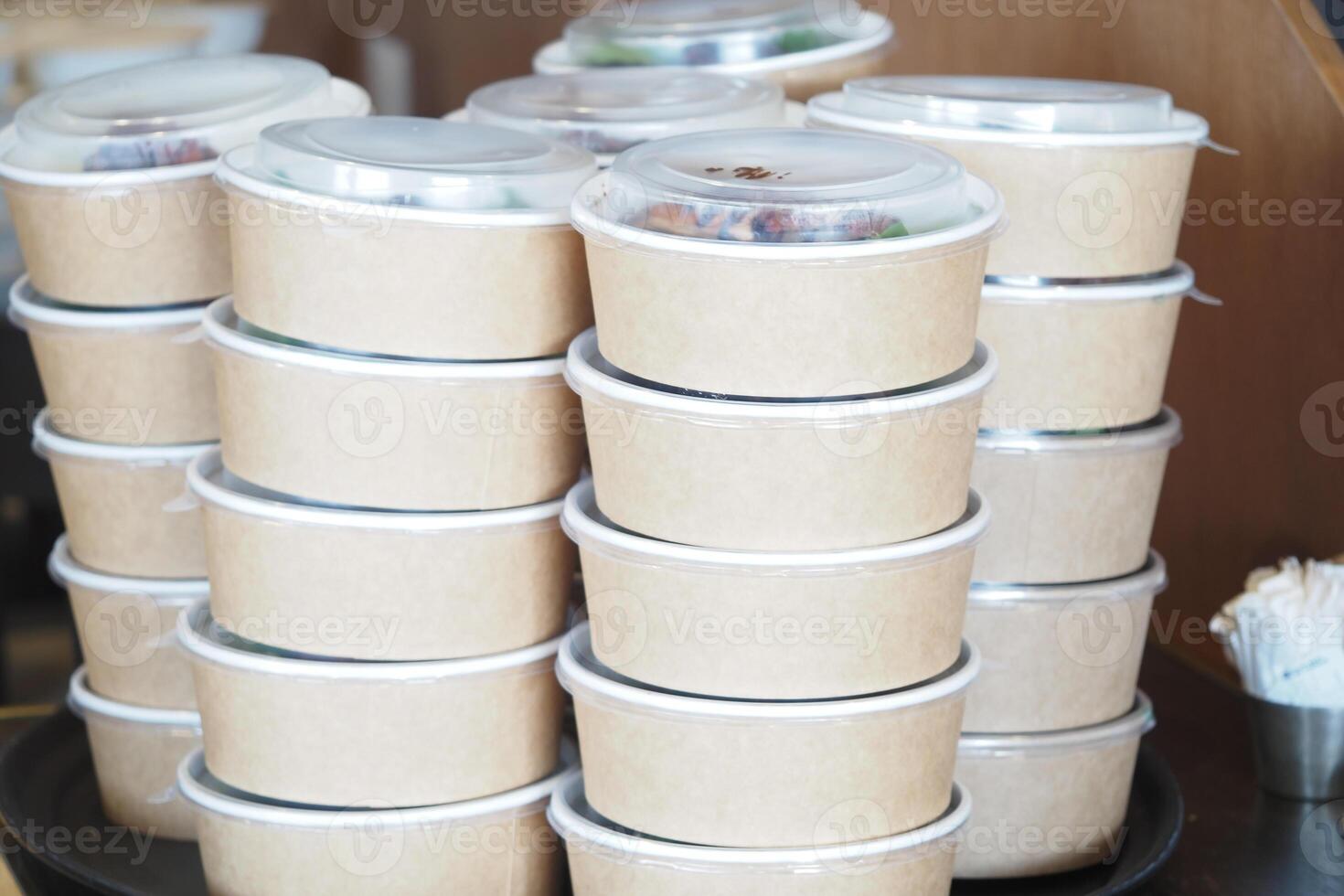 Food containers stacked in a restaurant for takeout service photo