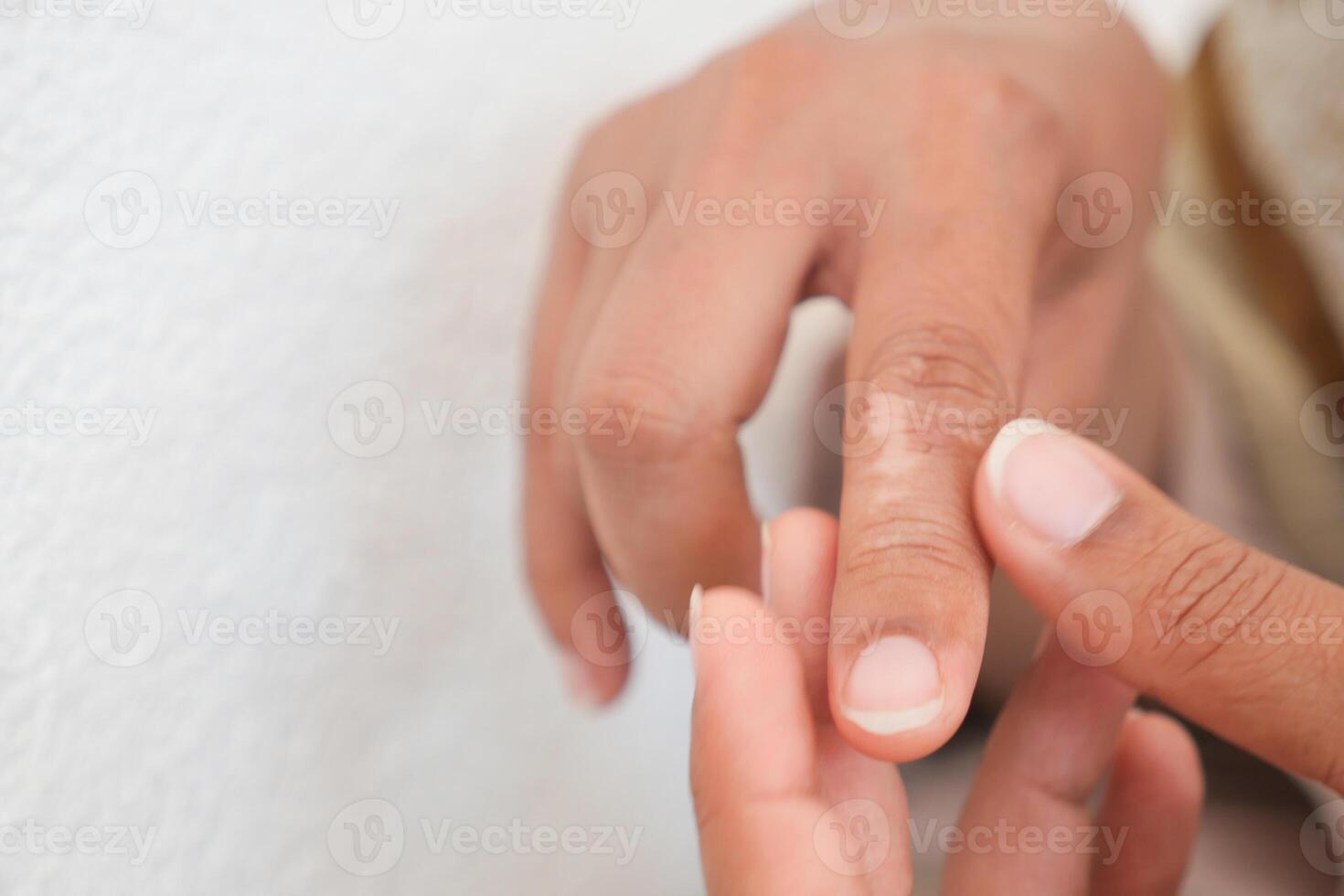 person suffering pain on finger photo