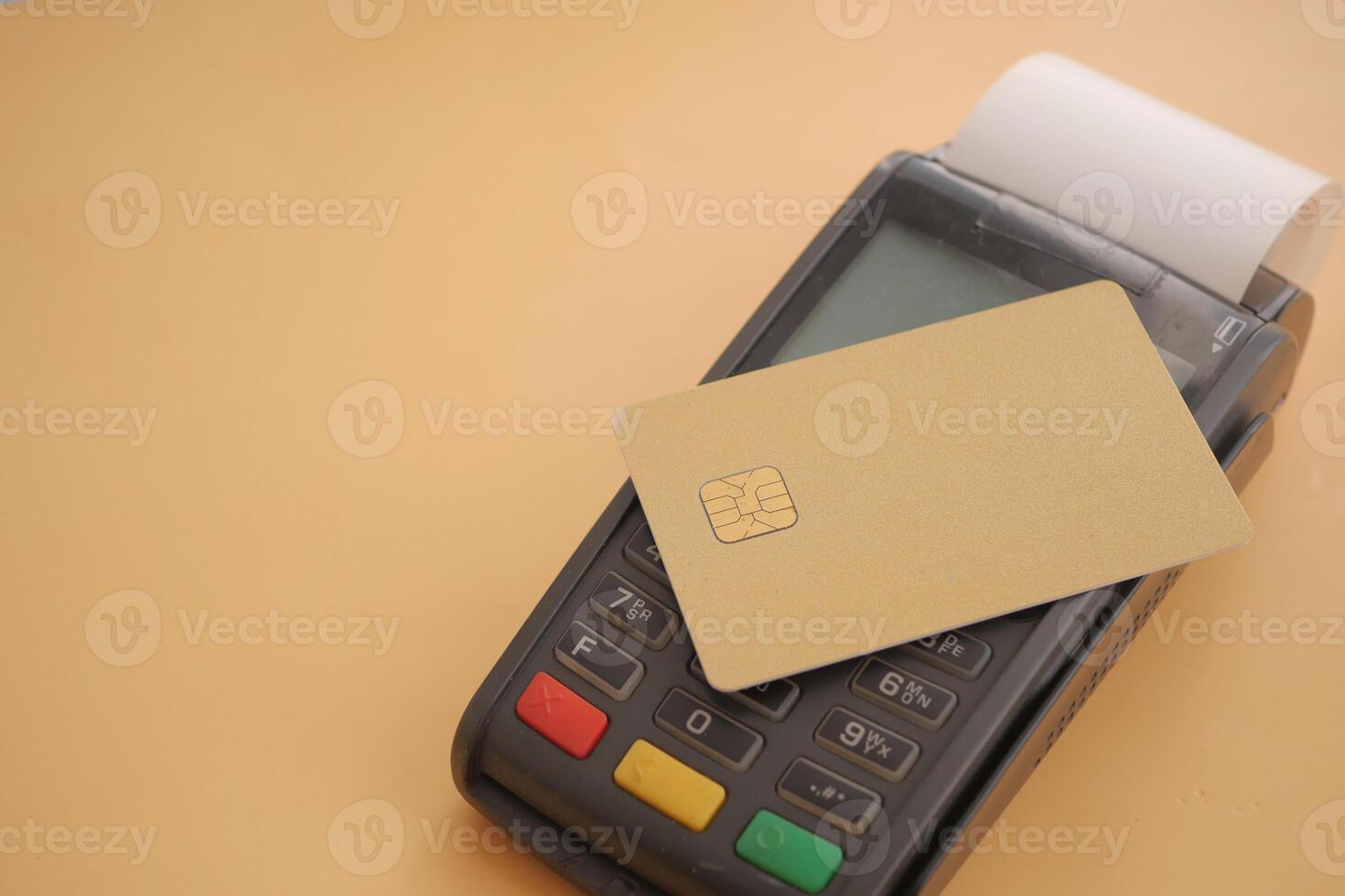 Payment terminal with card on countertop in retail space photo
