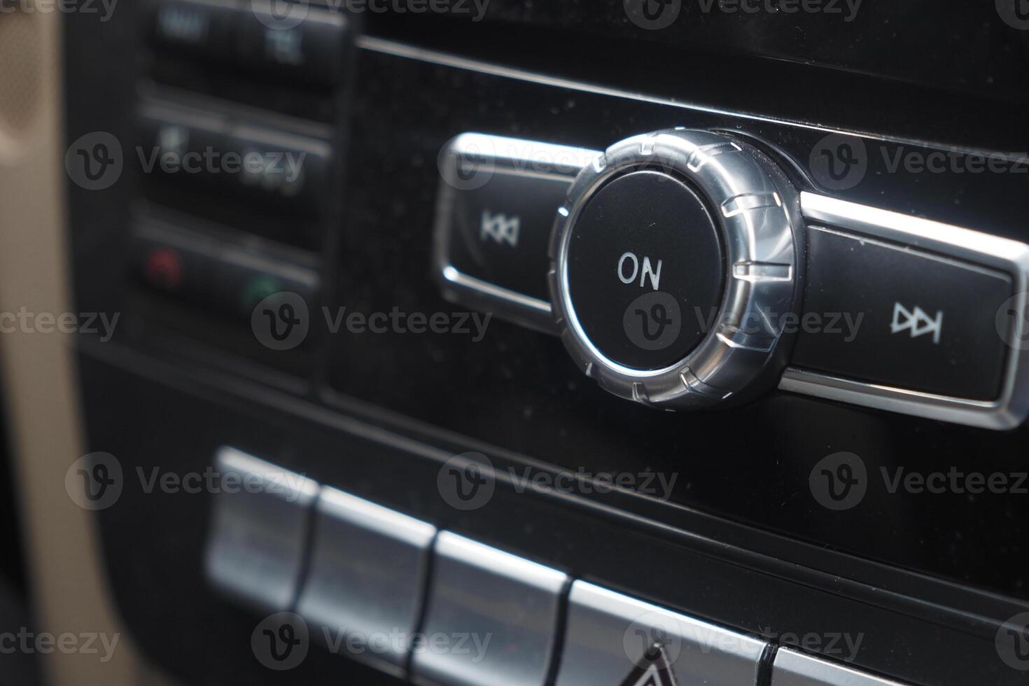 Control knob switches on car media system in dashboard photo