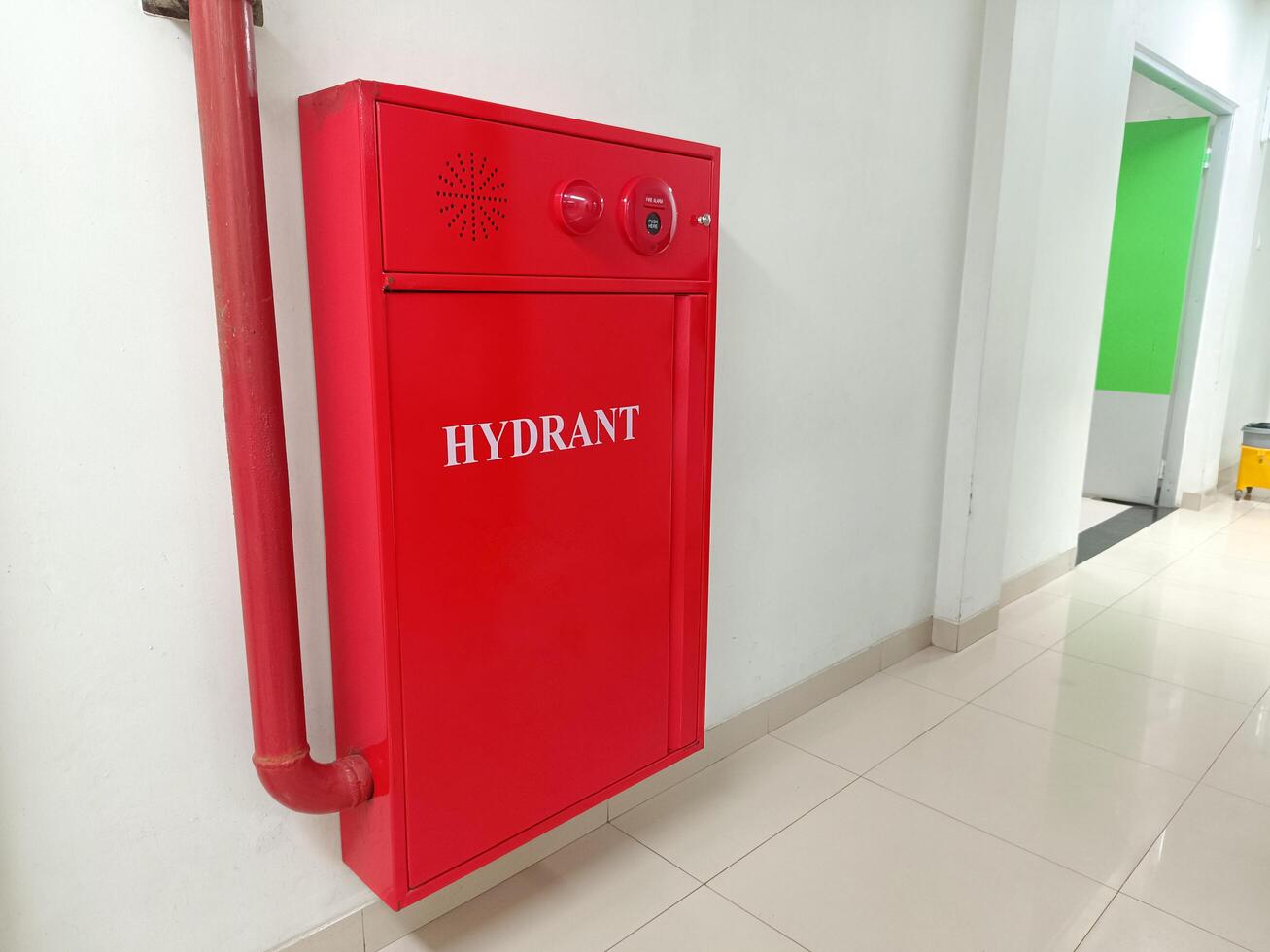 A red fire hydrant box installed in the corridor of a hospital. photo