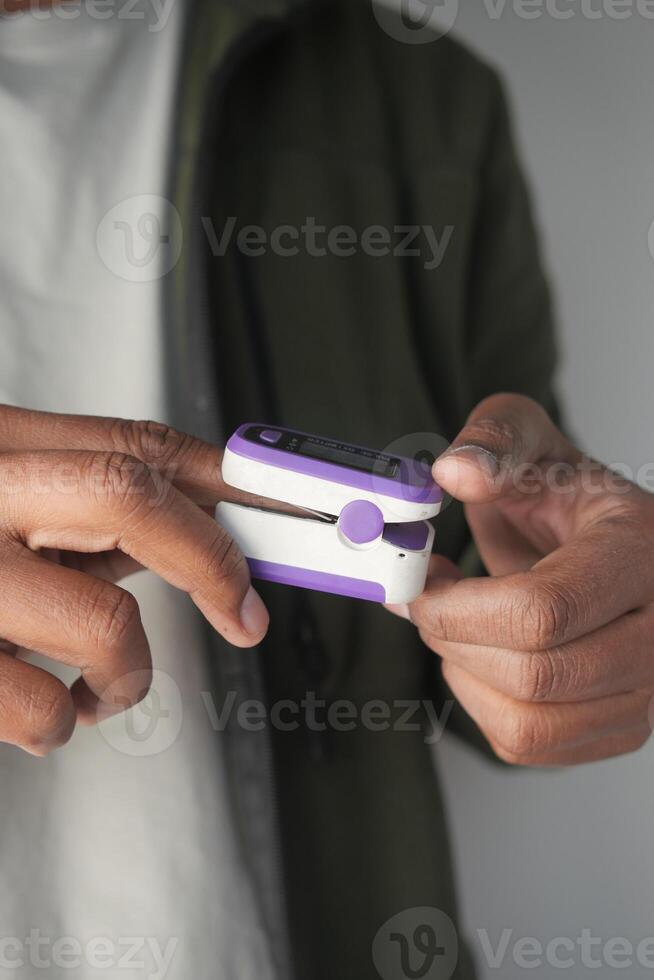 Using a fingertip device for health monitoring photo