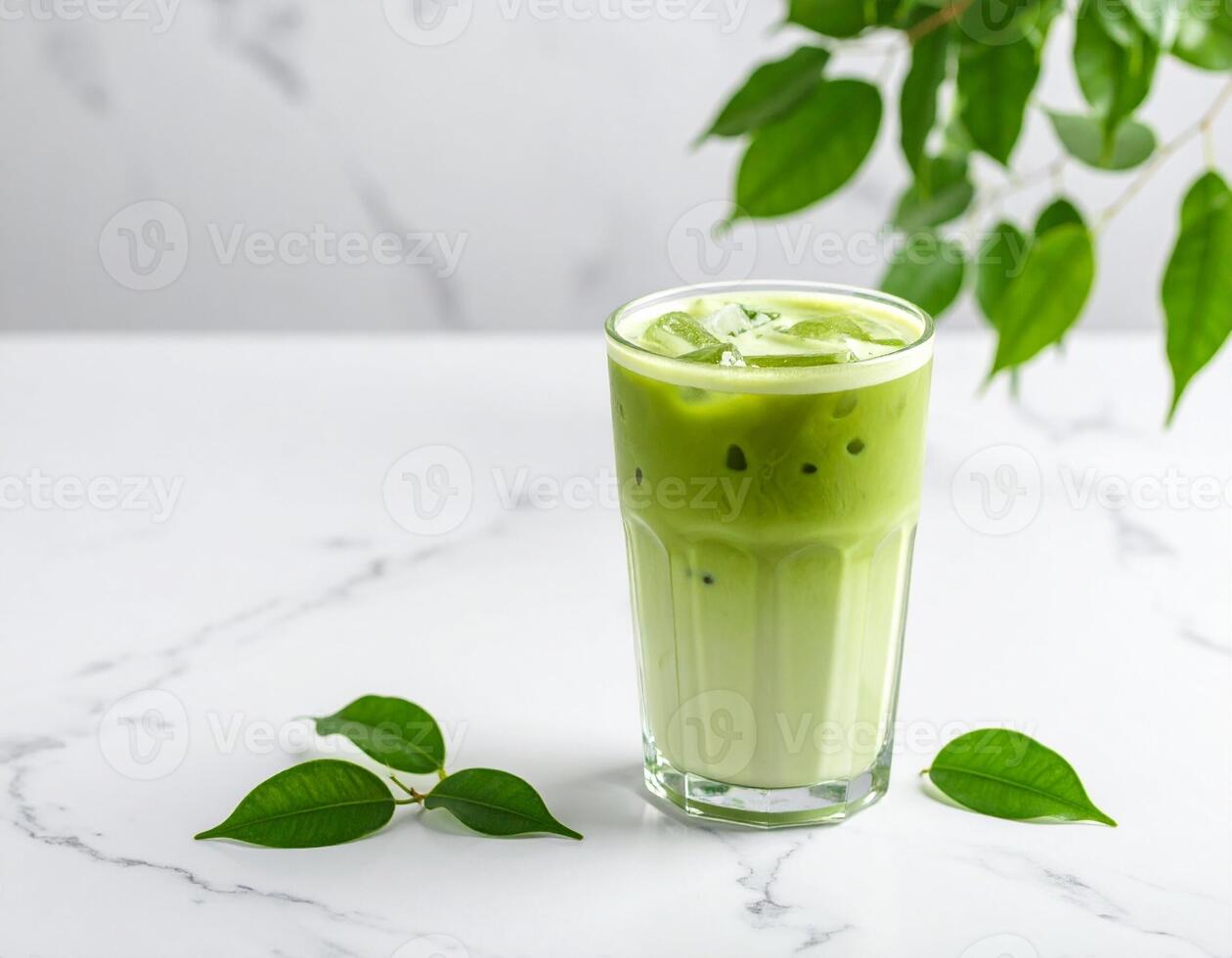 Iced Matcha Latte in Glass on Terrazzo Tabletop Side Angle photo