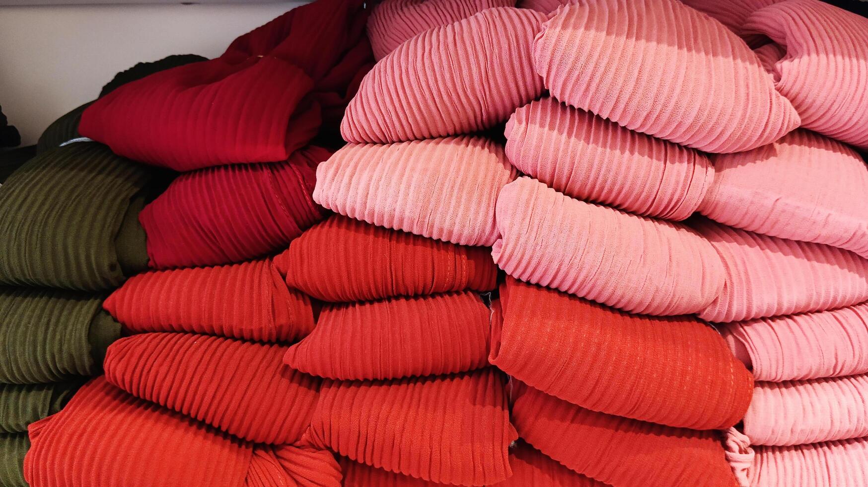 Veils in various shades of red are on display. photo