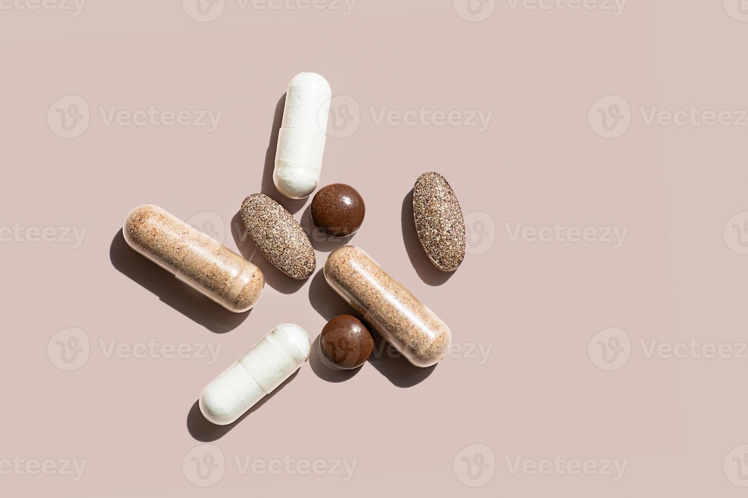 Collection of Various Dietary Supplements Including Capsules and Tablets in Different Colors and Shapes. photo