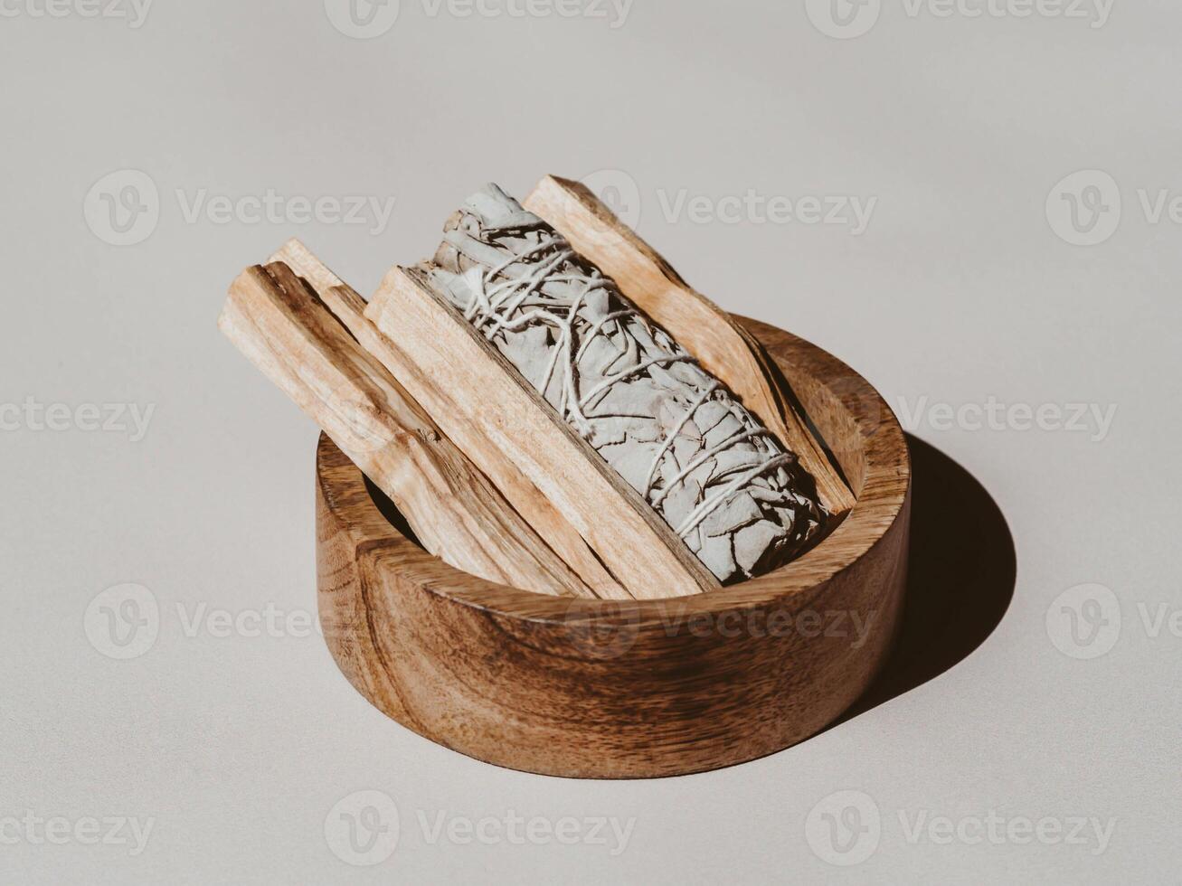 White sage, Palo Santo sticks in wood box on a light background. photo