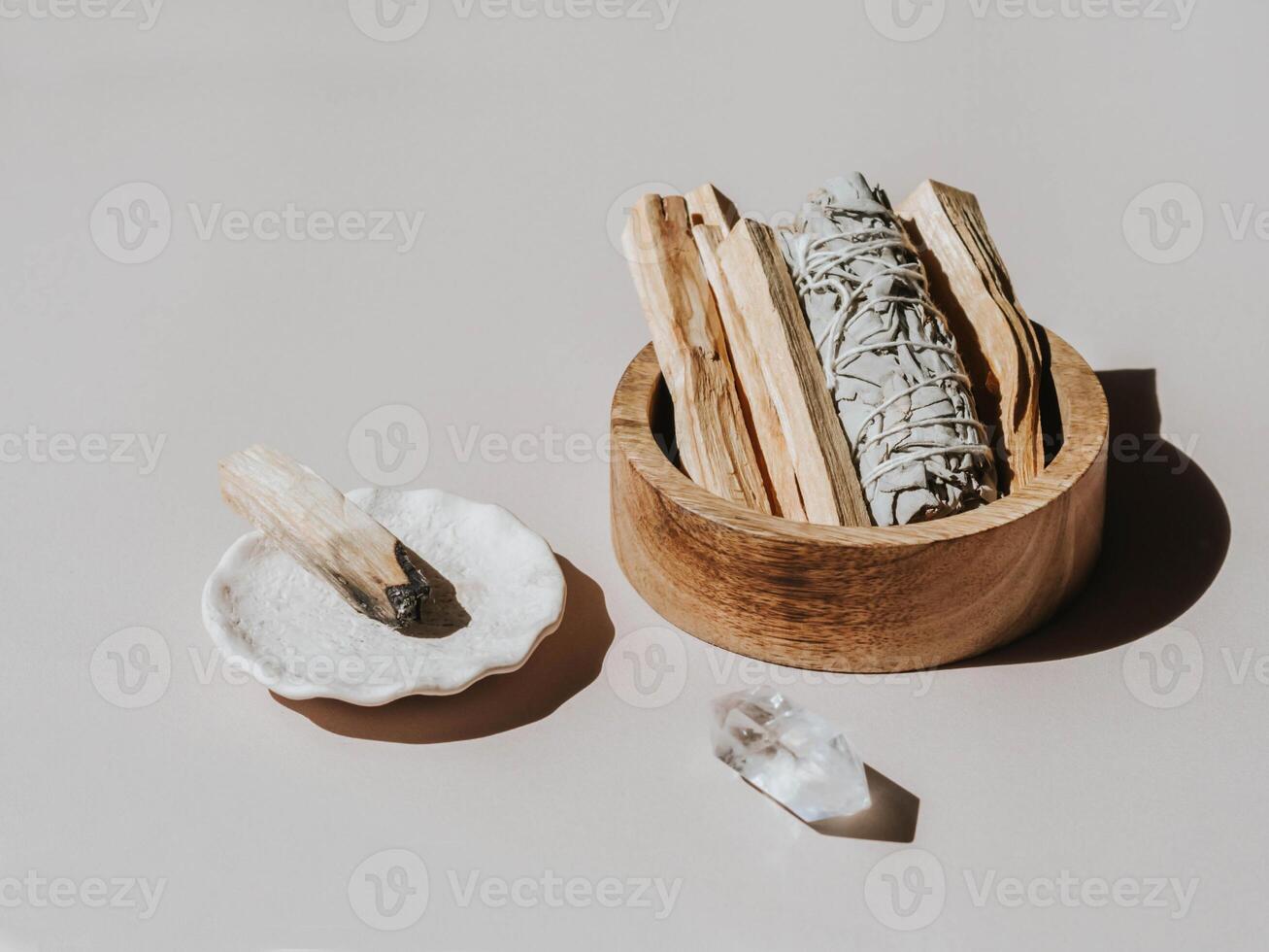 Sage and Palo Santo in wood box on light background. photo