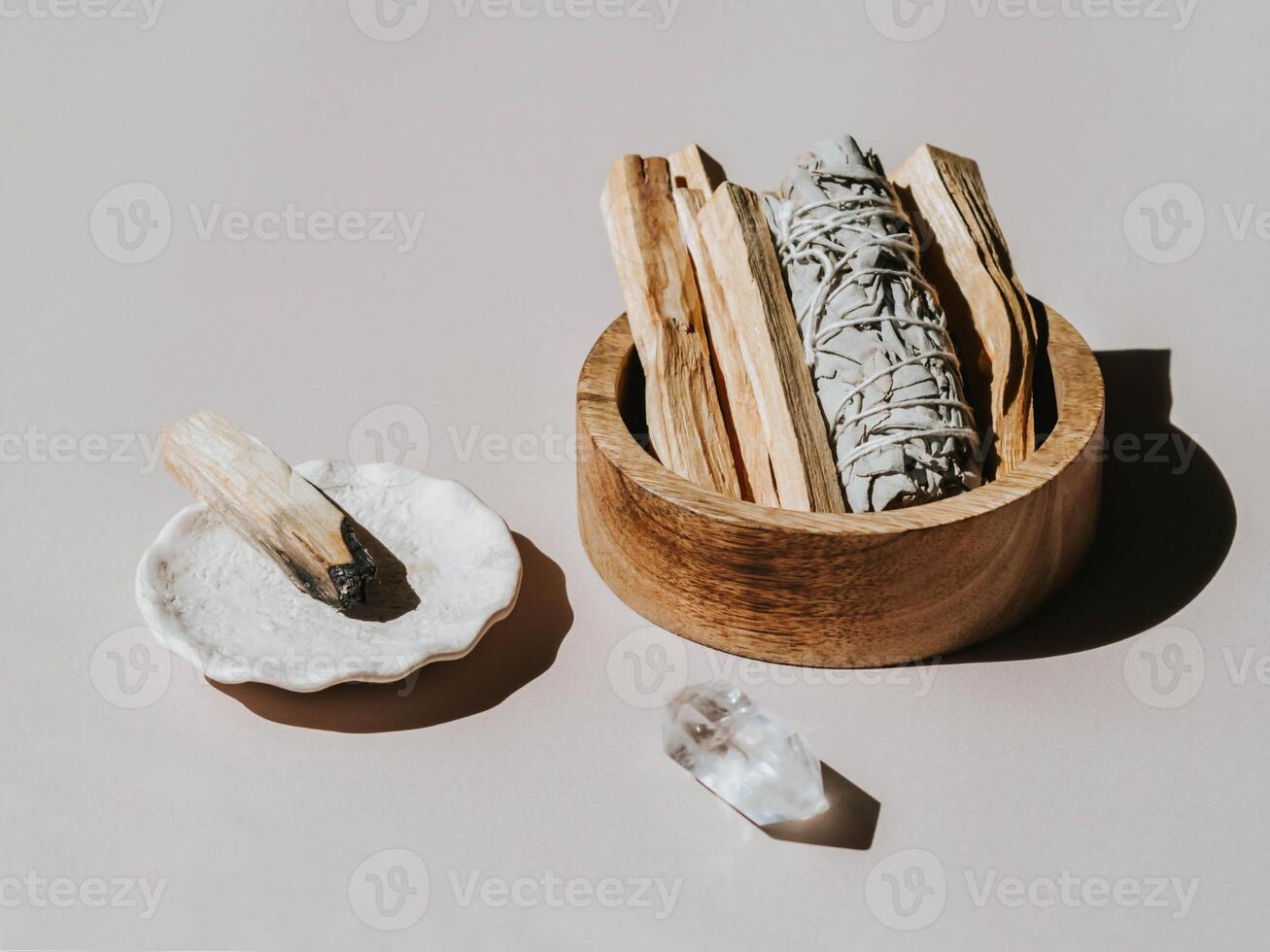 White sage and Palo Santo in wood box on light background. photo
