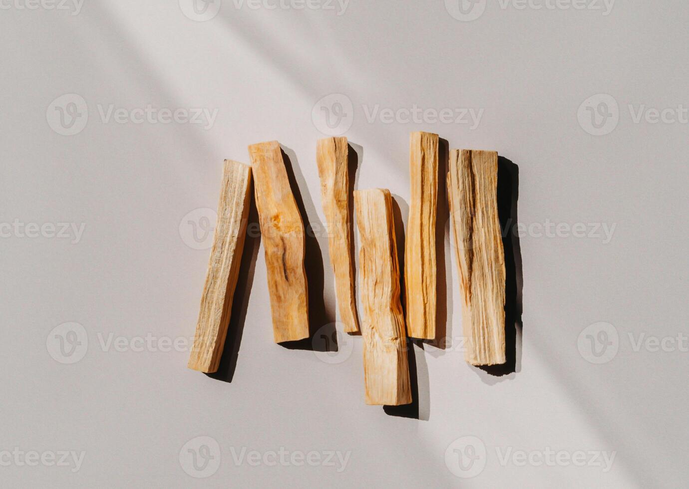 Wooden sticks Palo Santo on grey background photo