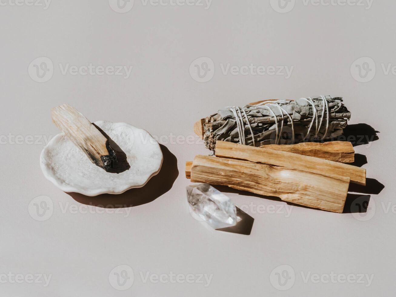 White sage and Palo Santo on light beige background. A set of incense for fumigation photo