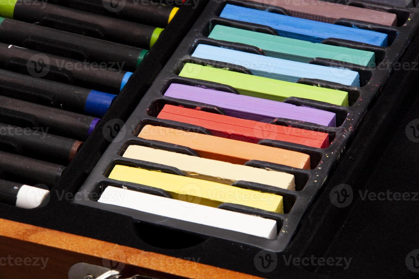 Close-up of colorful pastel sticks and crayons neatly arranged in an artist's box. Perfect for art supplies promotion, creativity ads, and educational content. photo