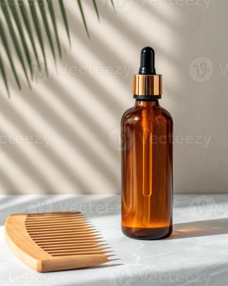 A bottle of hair care products and a comb photo
