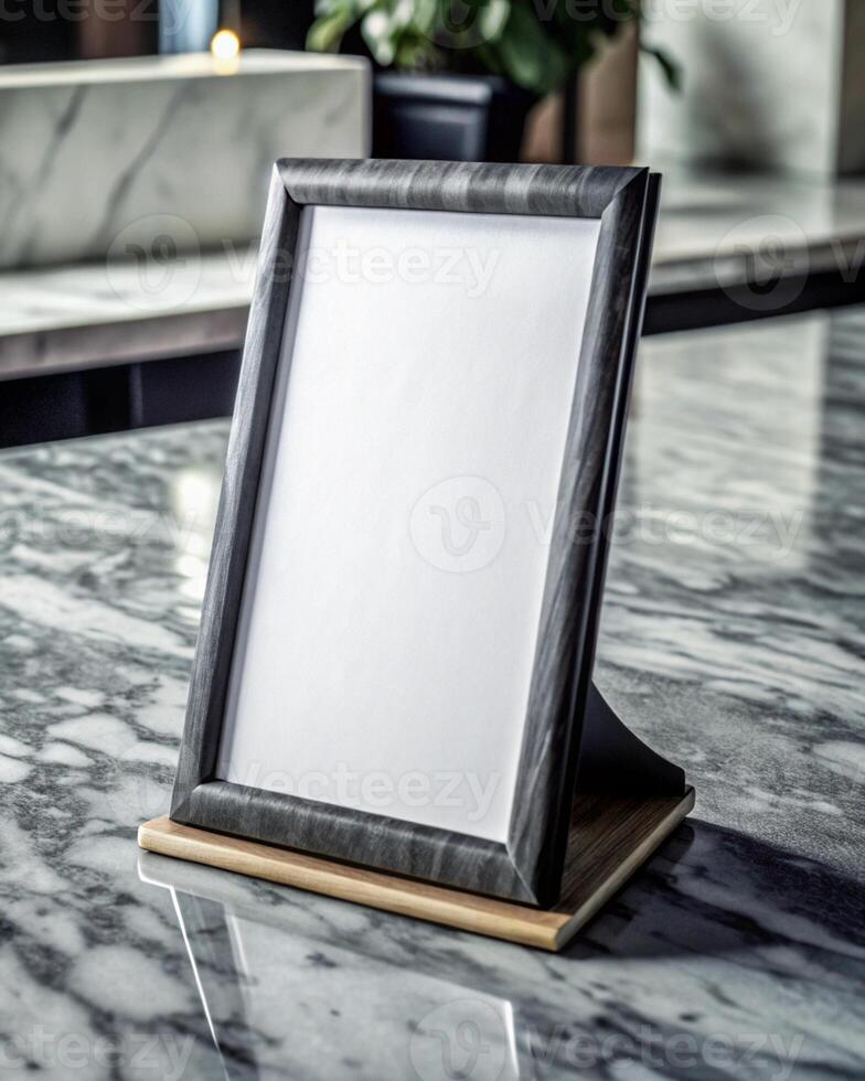 A blank photo frame on a marble counter