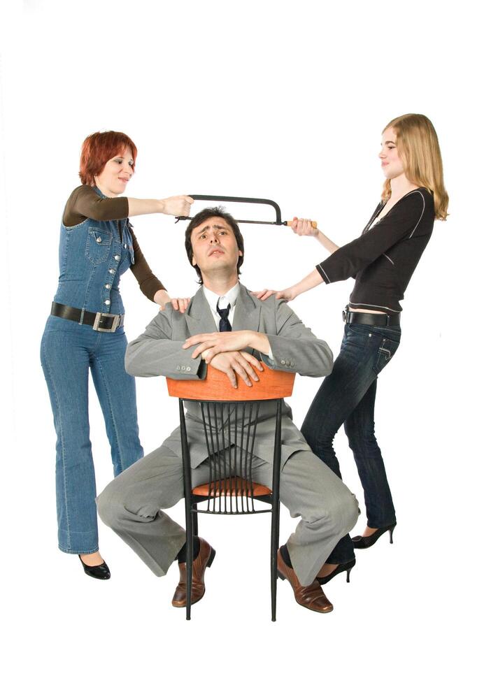 Two women dividing a man photo