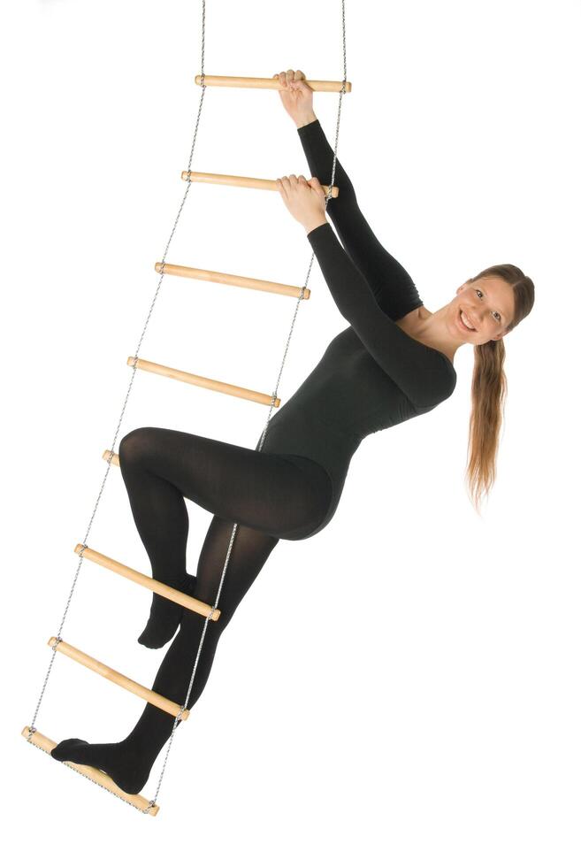 Woman on a rope ladder, white background photo