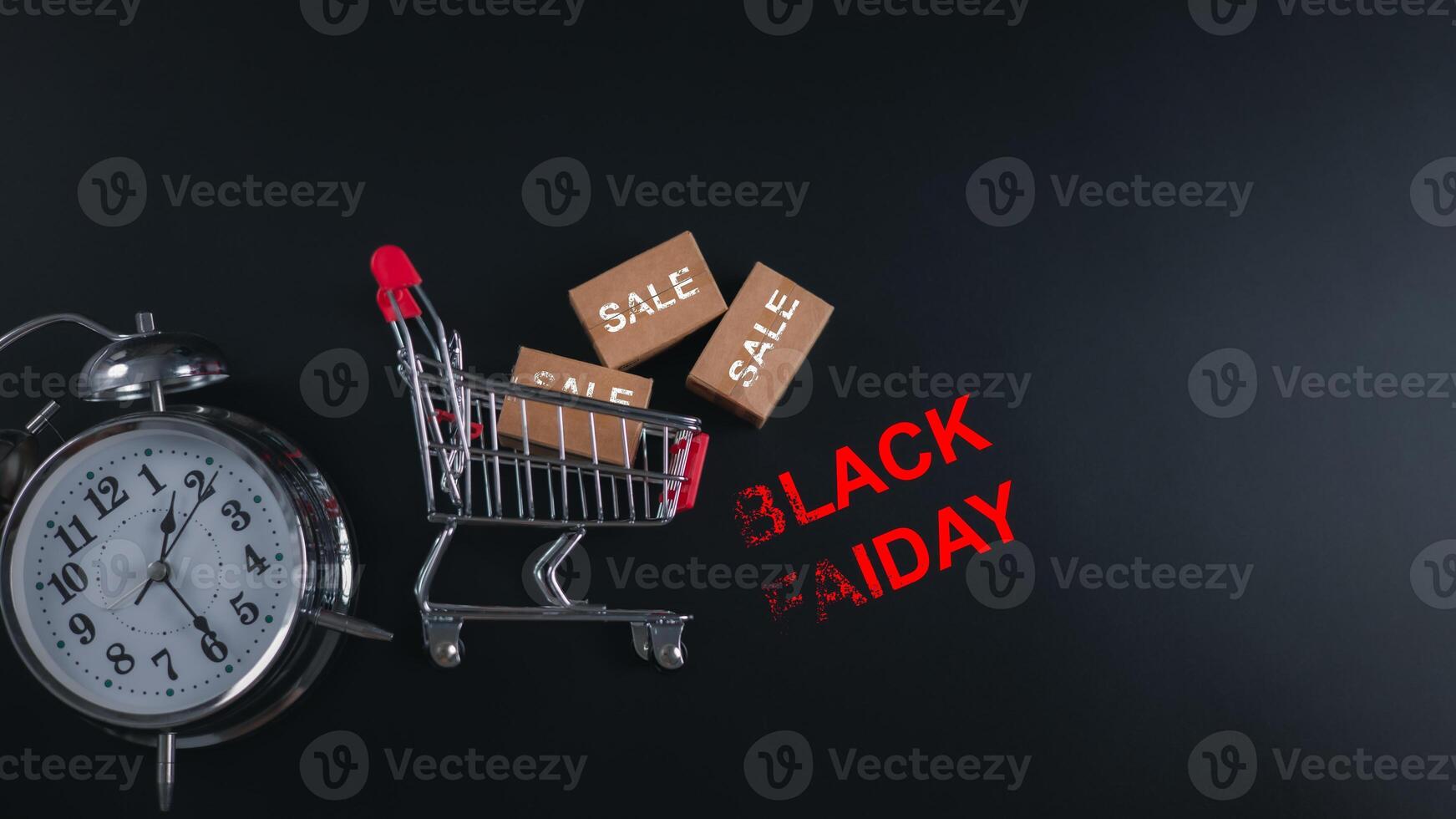 Discount events, Alarm clock and shopping cart with BLACK FRIDAY text, symbolizing time-sensitive sales, holiday shopping urgency and ecommerce promotions. retail marketing, and urgent deals. photo