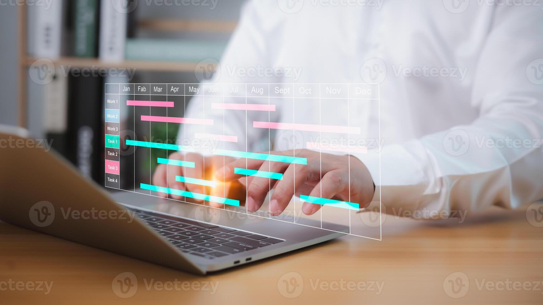 Businessman using project management software on a laptop to schedule tasks, update Gantt charts, and manage workflow, enhancing planning, productivity, and business progress. photo