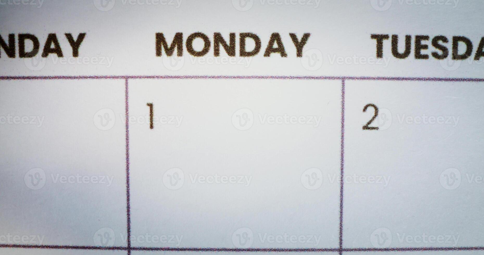 The person circles the inscription Monday in the calendar with a red marker. Close up of the marker photo