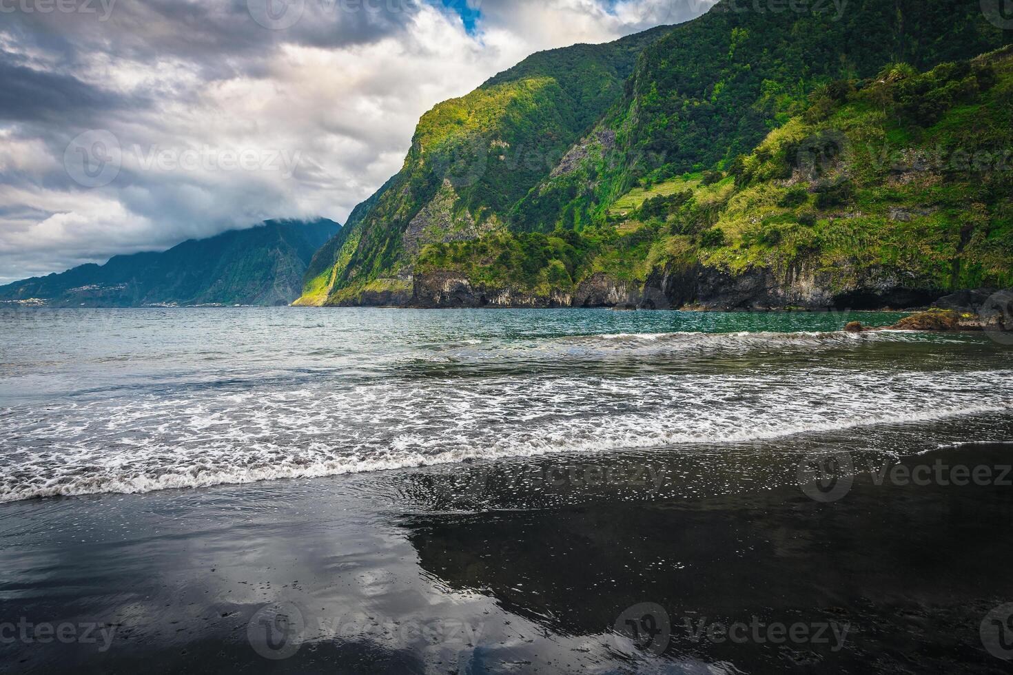 Stunning beach view with black sand, Seixal, Madeira Island photo