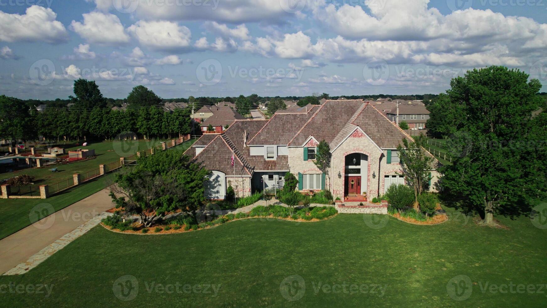 An overview of an old cottage in a low rise building area in America. Drone . A sunny summer day photo
