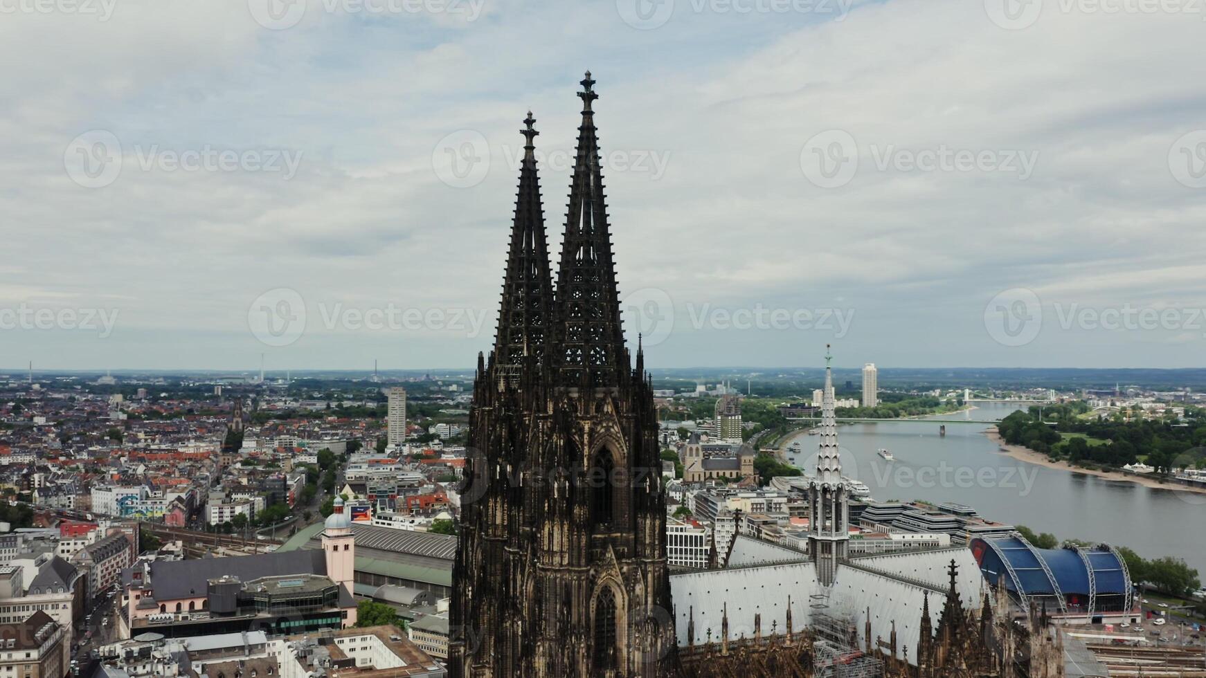 Overview of spiers of the Cathedral of Saints Peter and Mary, panoramic bird's eye view from a drone. Cologne Cathedral in the historic city center. Cologne, Germany photo