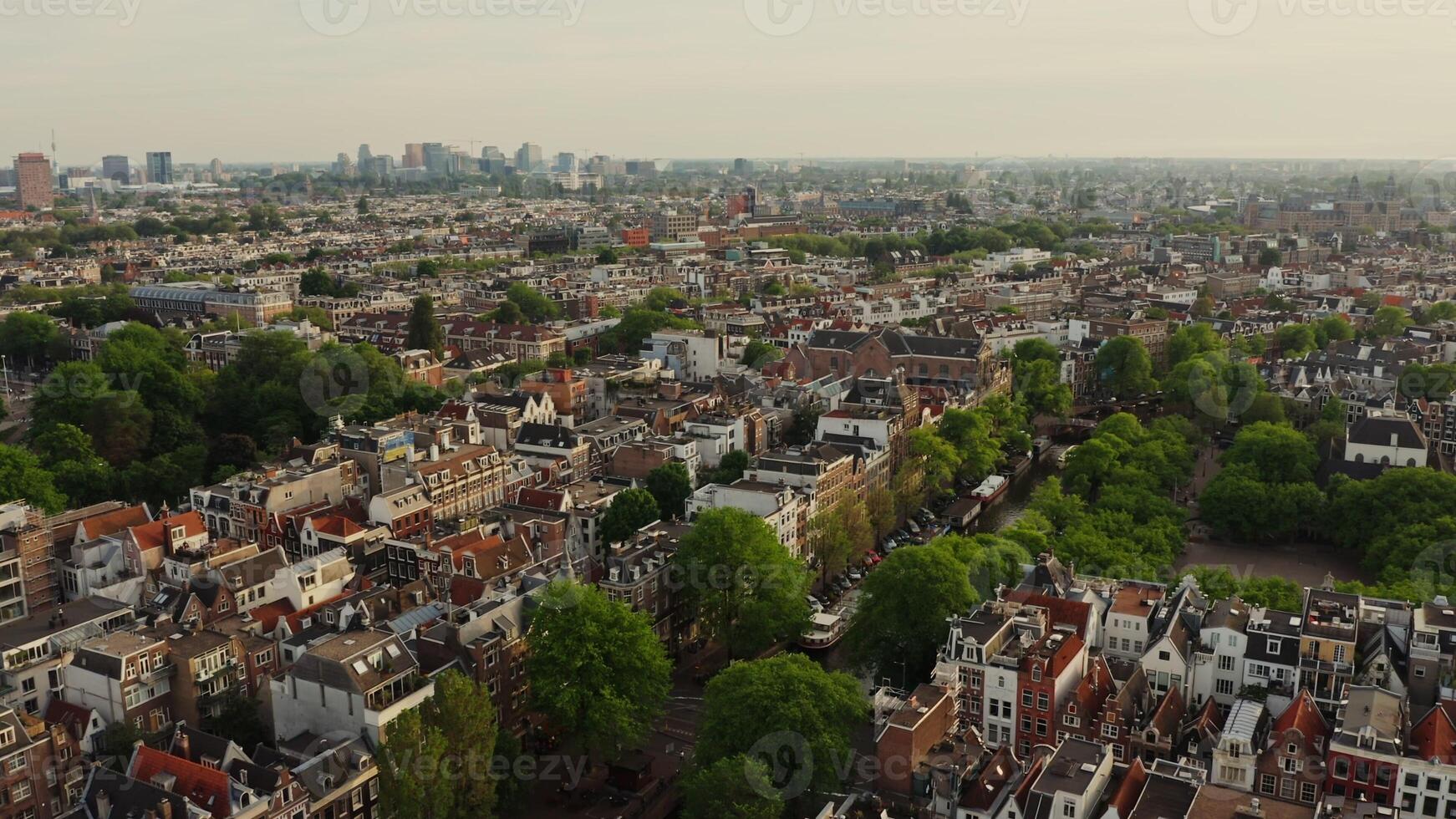 Historic center of Amsterdam with traditional houses on both sides of the canal. from a bird's eye view, from a drone photo