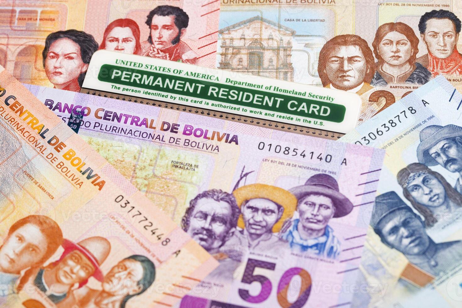 American Permanent Resident Card on Bolivian money photo