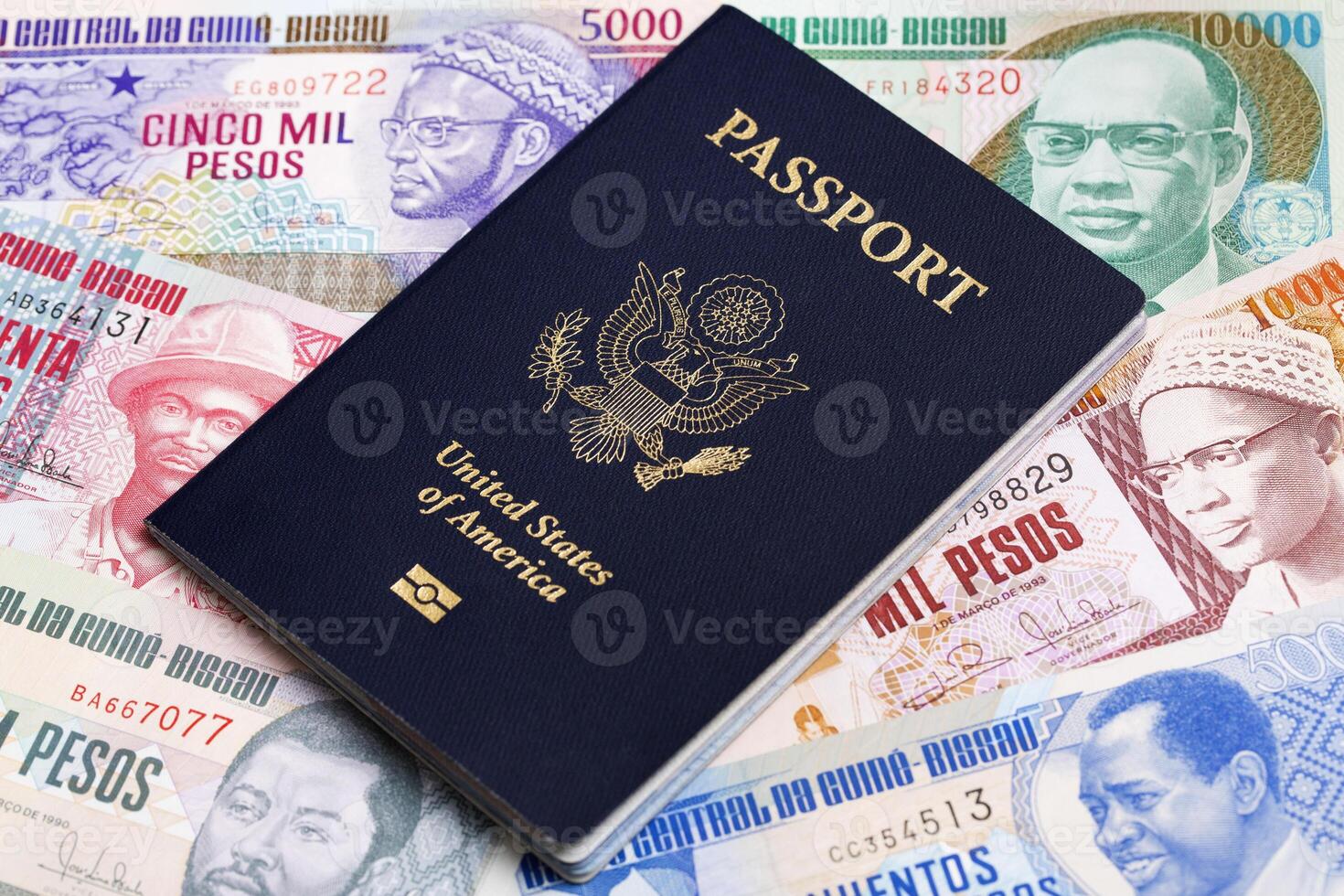 American passport on a Guinea Bissau money photo