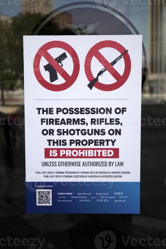 Sign the possession of firearms, rifles or shotguns on this property is prohibited in New York, in United States of America photo