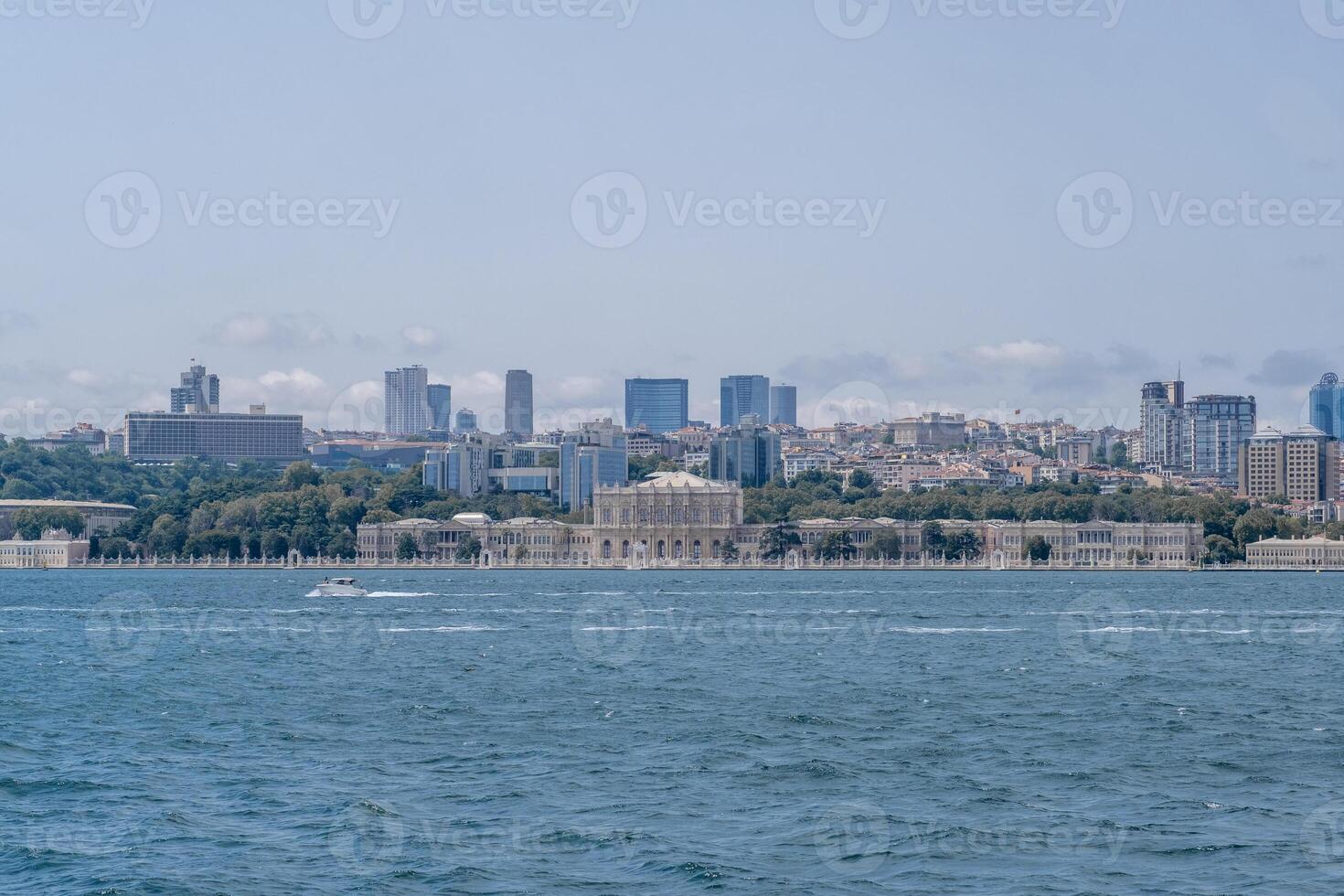 Bosphorus view showcasing modern skyline and historical architecture under clear sky photo