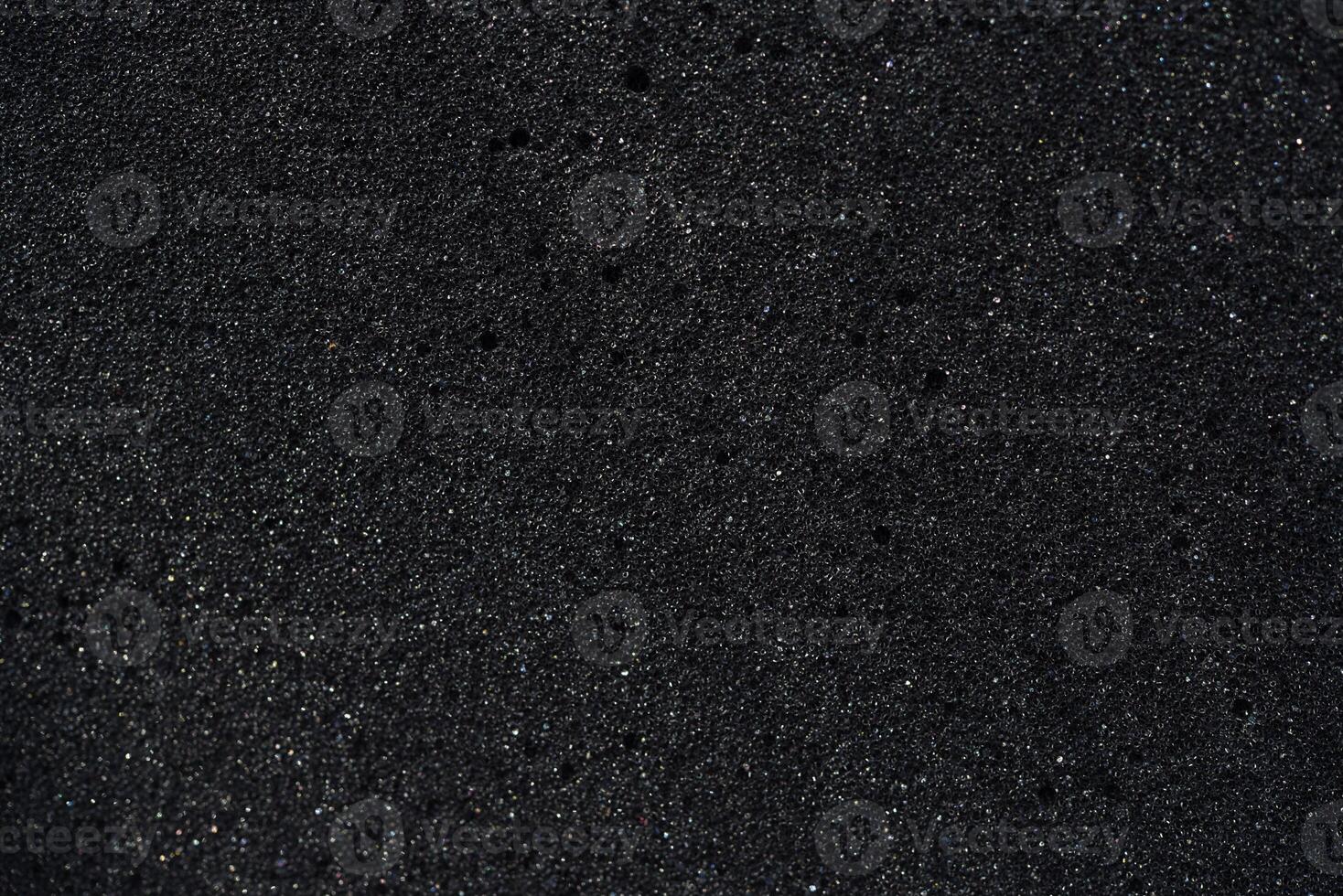 Foundation of cellular latex foam. Black foam rubber. Packaging material. photo