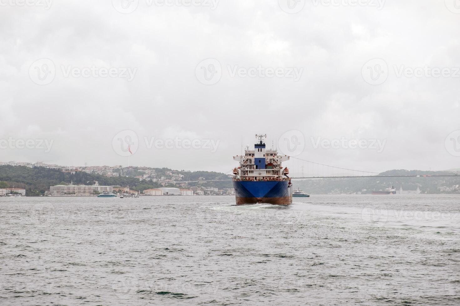 Bosphorus waterway bustling with shipping traffic and cloudy skies photo