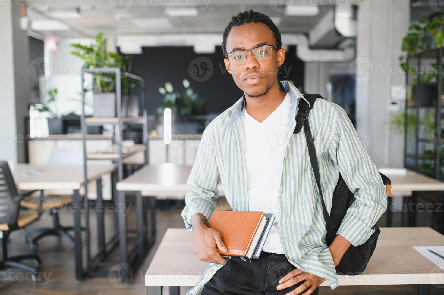 Young medical student studying in modern university library photo