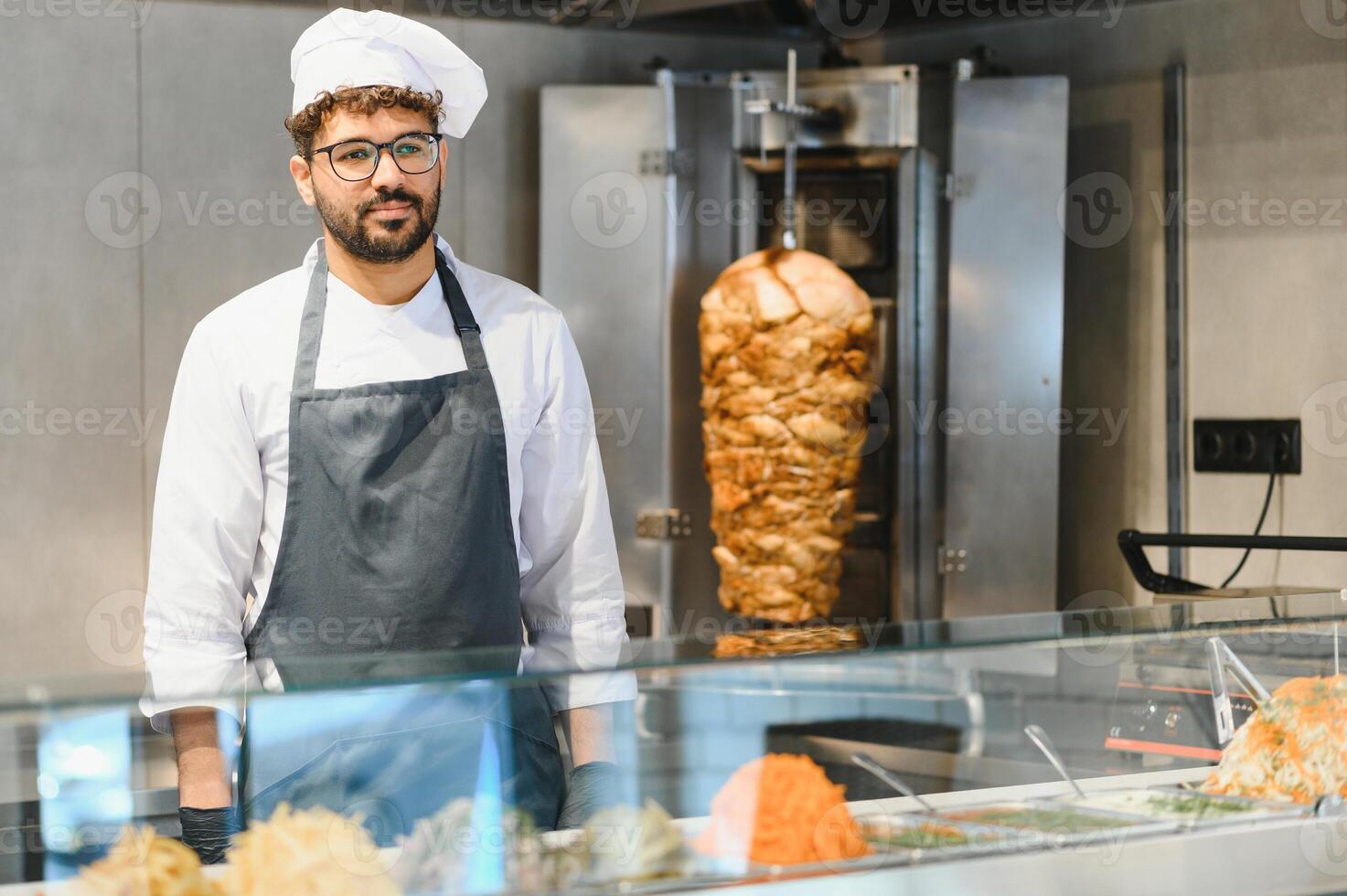 Chef preparing shawarma in a modern fast food restaurant photo