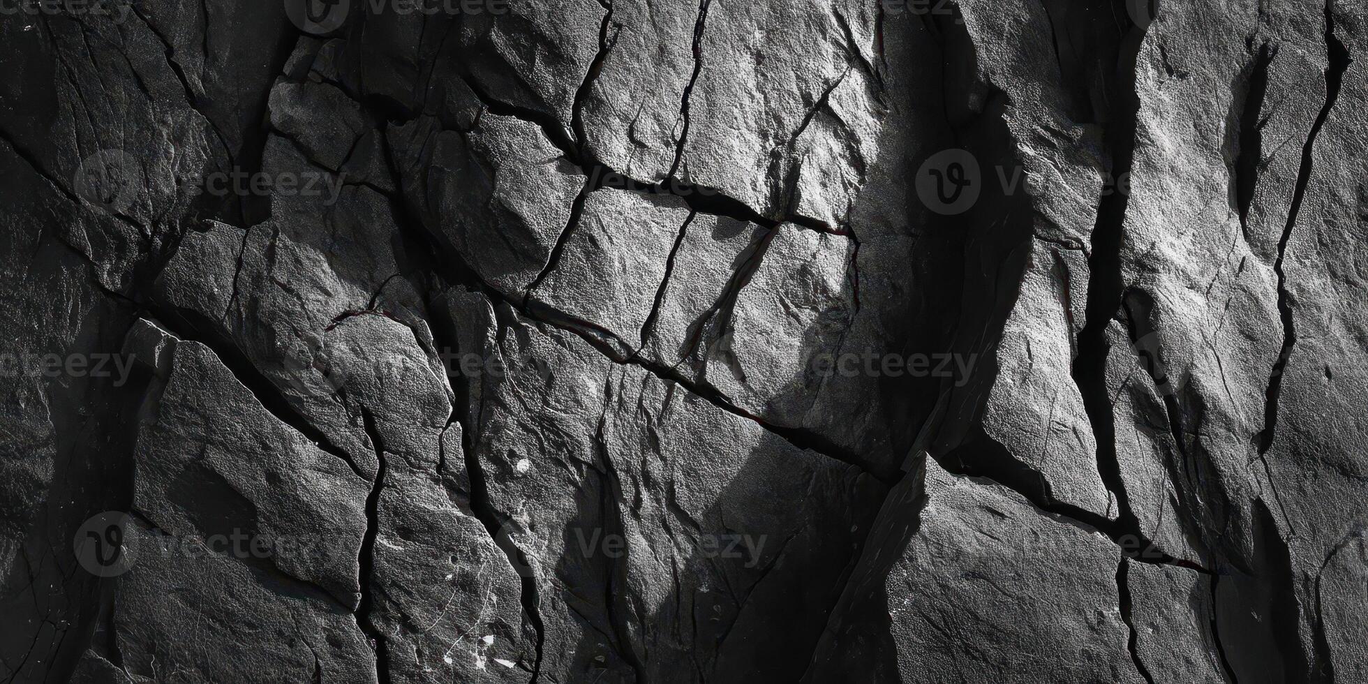 Detailed texture of cracked dry earth surface in shadow photo