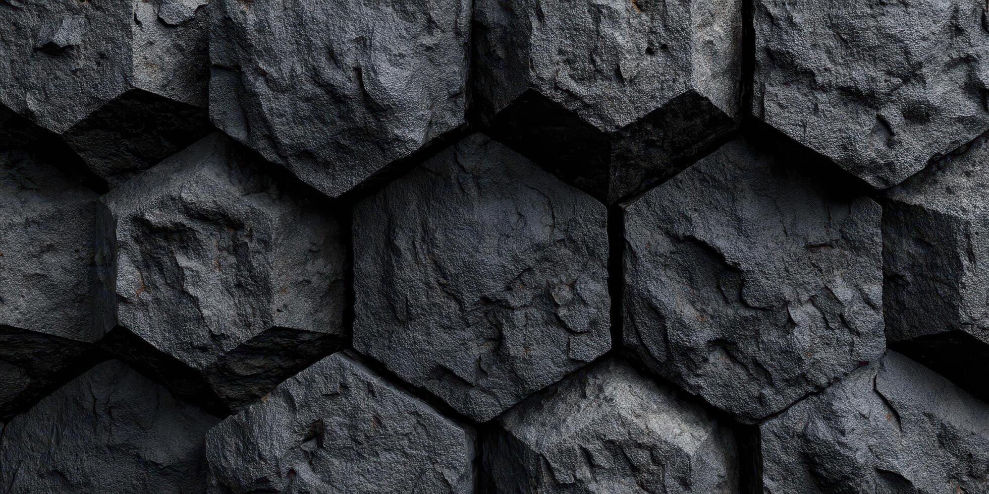 Close up of textured dark hexagonal stone blocks surface photo