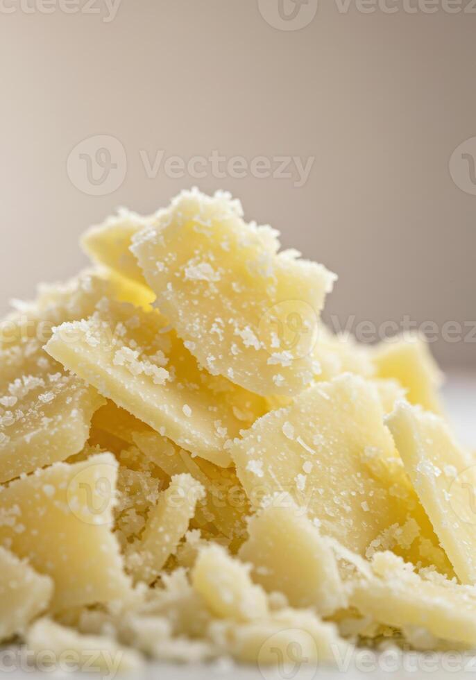 A mound of parmesan cheese flakes, capturing the essence of quality ingredients. photo