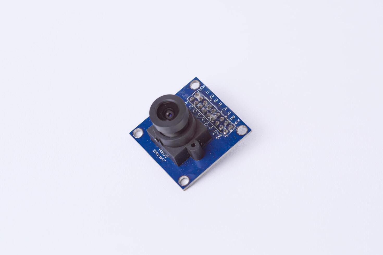 Malang, March 24, 2025. Side view of OV7670 VGA CMOS camera module for microcontroller projects. Ideal for image processing, surveillance, face detection. Isolated on white background. photo
