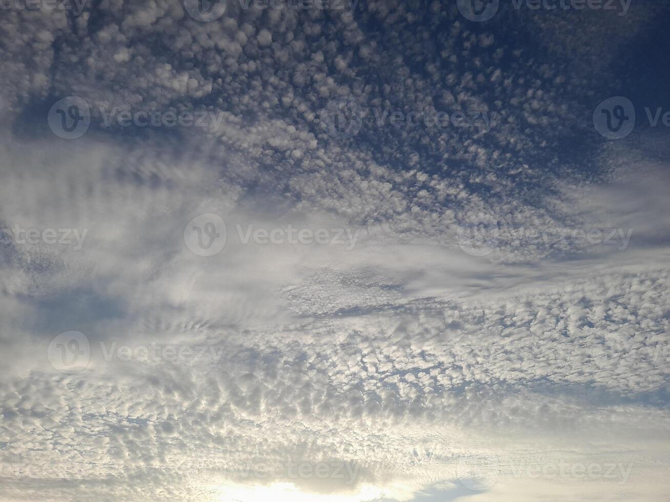 A beautiful sky filled with textured altocumulus clouds creating a soft and intricate pattern photo
