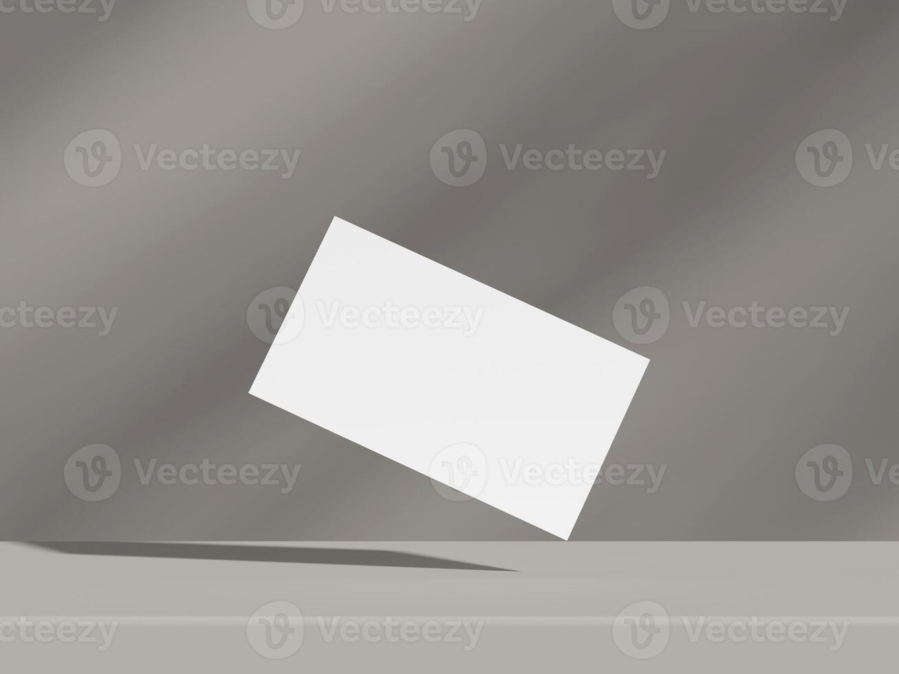 Minimalist business card mockup floating on grey background with dramatic lighting photo