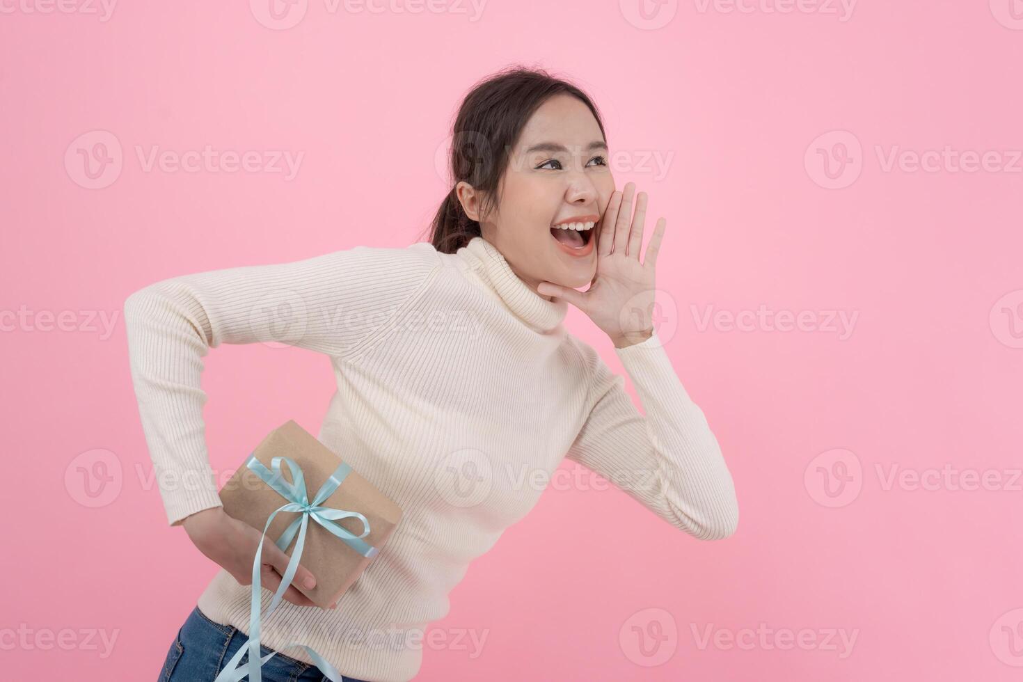 Asian beautiful woman exited surprise face expression . female feels wow on background. exciting smile and happy adorable rejoices. Very enjoy and fun relax time. wow, girl holding gift box. photo