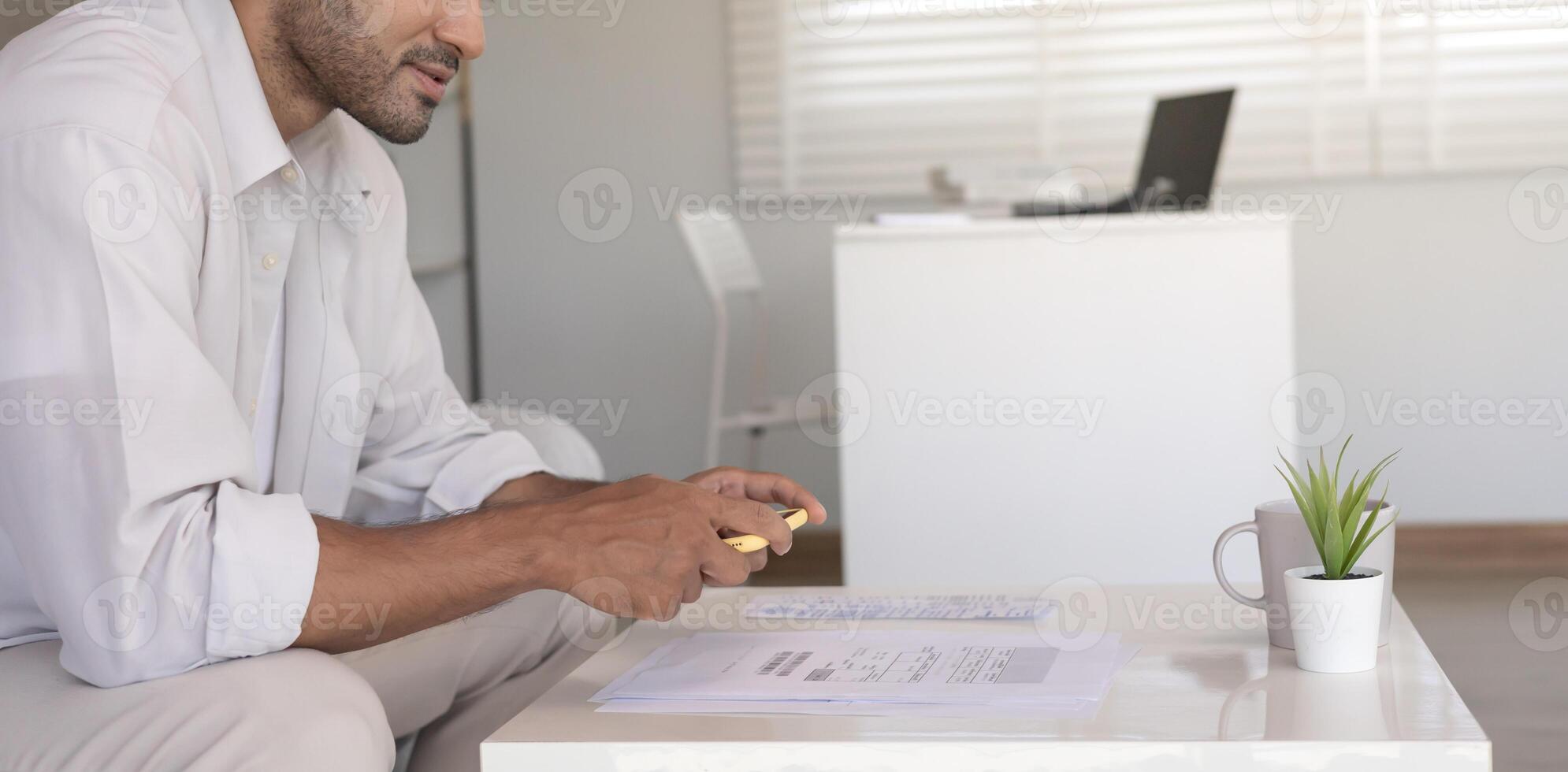 man use phone to scan barcode or QR codes to pay credit card bill after receiving document invoice online. payment, receive, paying electricity, digital payments without money, technology, photo
