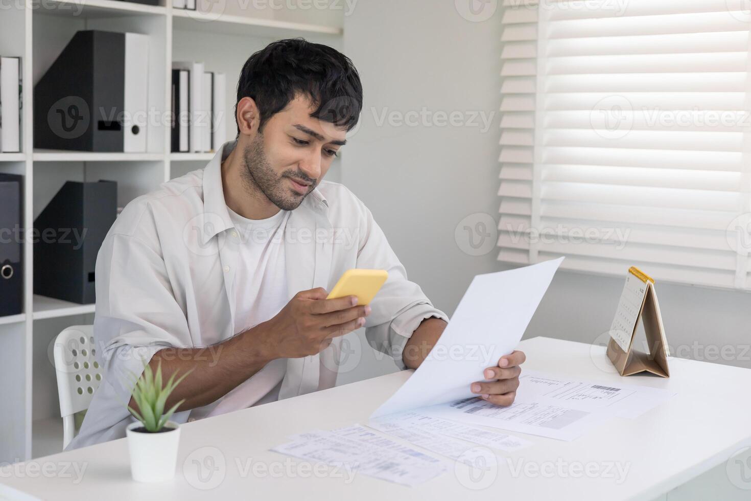 use phone to scan barcode or QR codes to pay credit card bill after receiving document invoice online. payment, receive, paying electricity, digital payments without money, technology photo