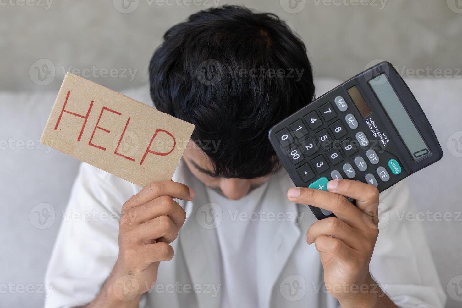 Stressed man with large bills or invoices no money to pay to expenses and credit card debt. shortage, Financial problem, bankruptcy, mortgage, loan, bankrupt, poor, empty wallet photo