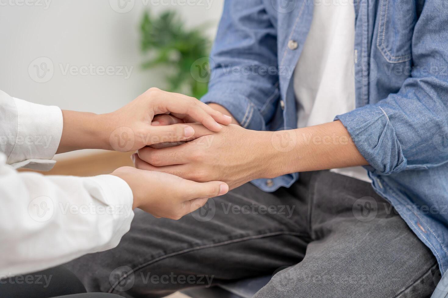 psychiatrist support each while discussing family issues. doctor encourages and empathy woman suffers depression. psychological, save divorce, Hand in hand together, trust, care photo