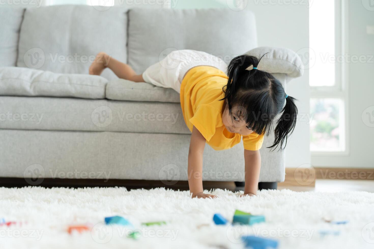Happy Asia children play and learn funny activity at home. Play stunts. daughter having fun spending time, Activity, development, IQ, EQ, meditation, brain, muscles, essential skills. photo
