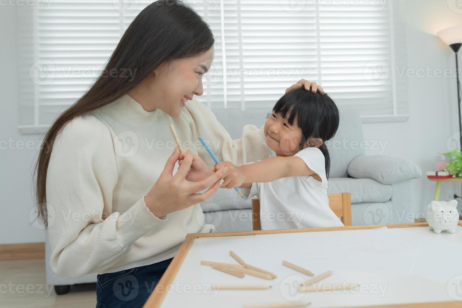 Mother day, mother play and learn draw for little girl. Funny family is happy and excited in the house. Mother and daughter having fun spending time together. Holiday, Activity photo